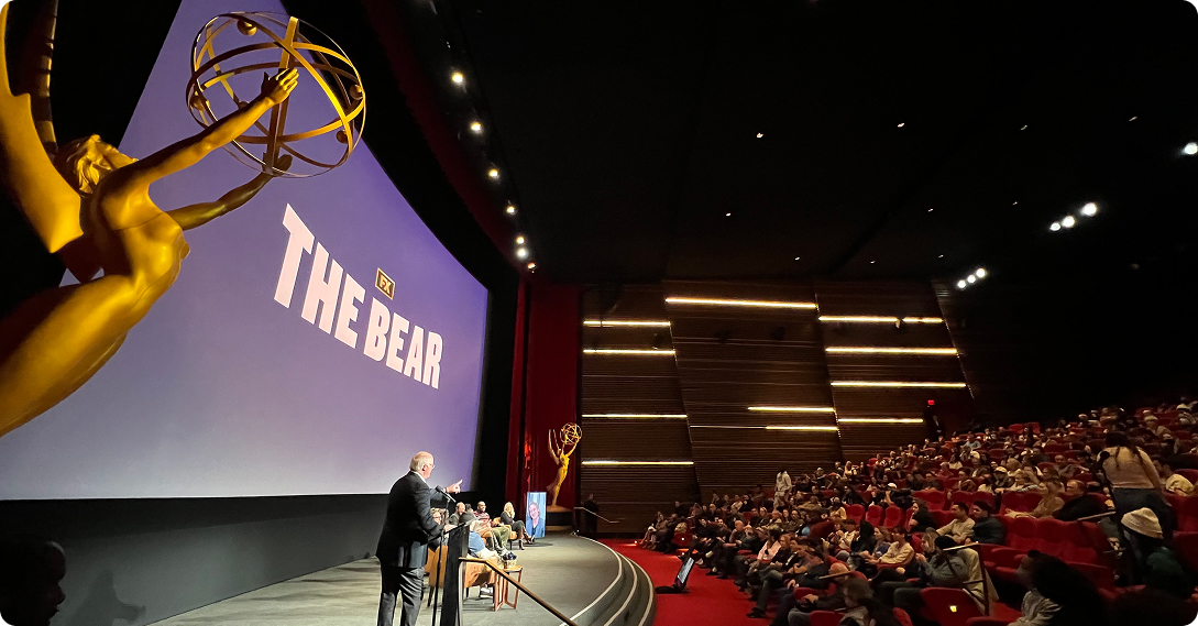 Theater premiere with live captions on screen